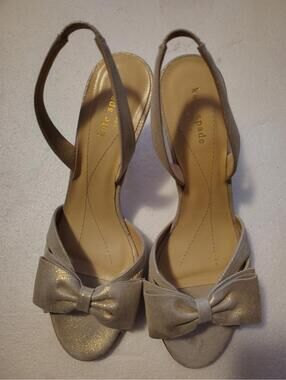 Kate Spade New York gold glitter slingback sandals feature a distinctive bow 10